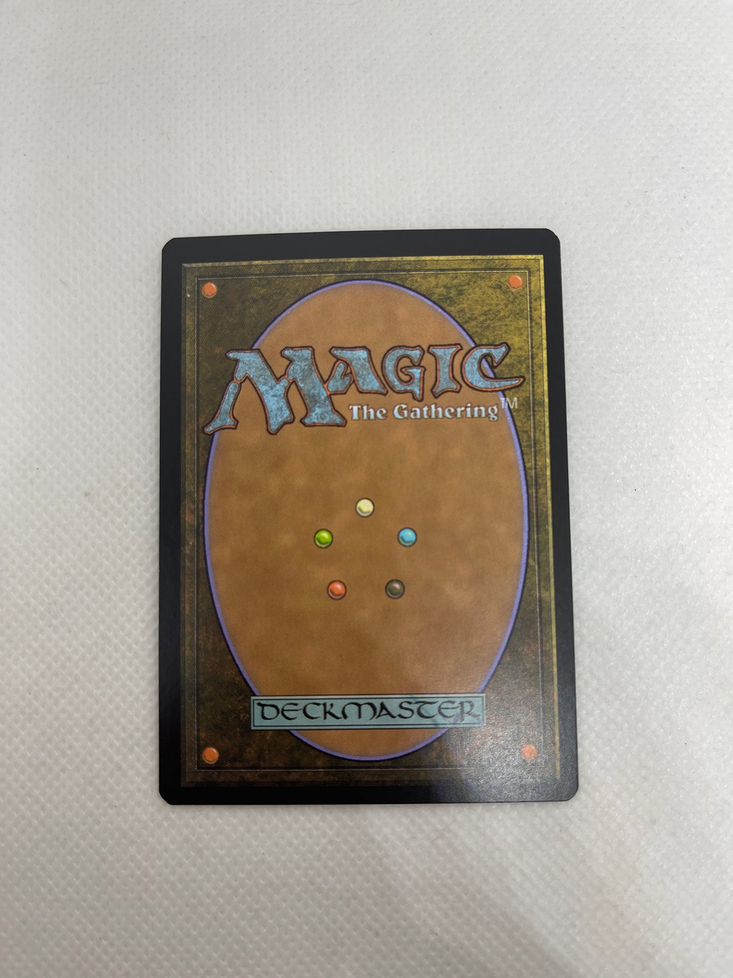 Trading card with 'Magic: The Gathering' branding on a textured surface