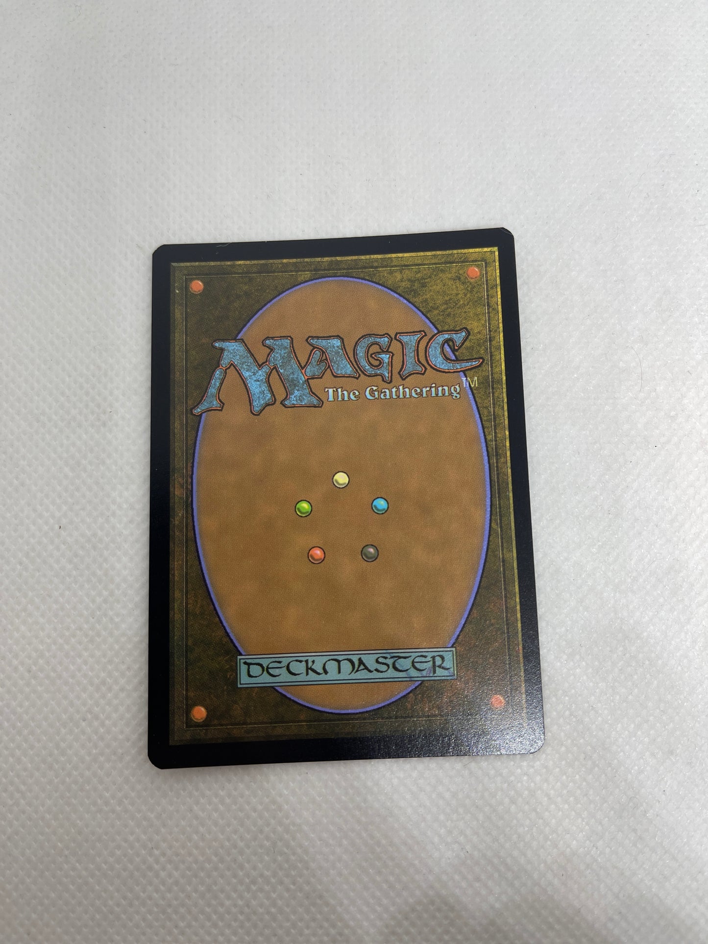 Trading card with 'Magic: The Gathering' branding on a textured white background