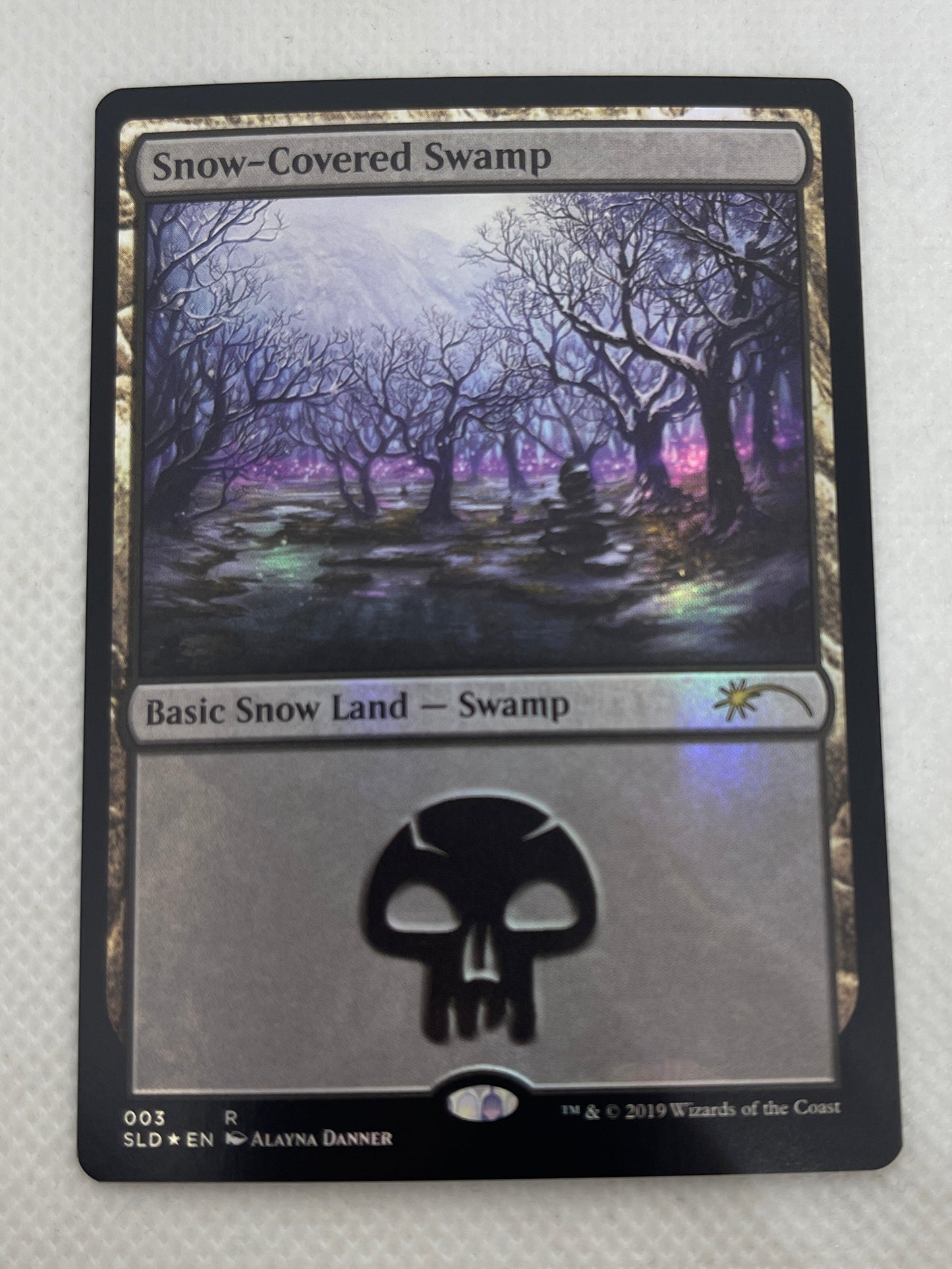 Card with a black border and central design on a white background