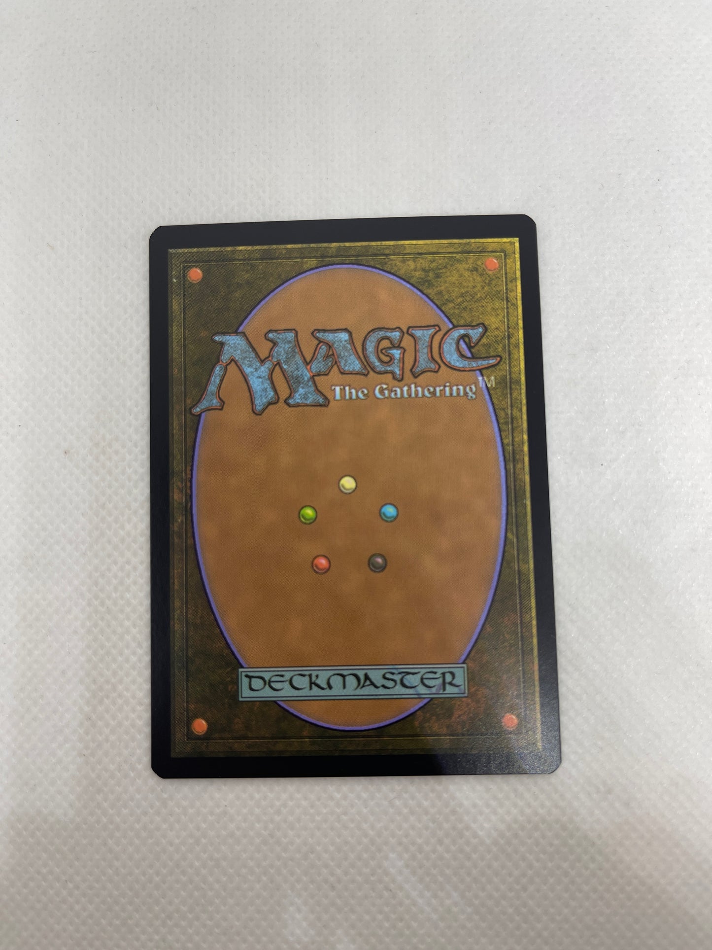 Trading card from 'Magic: The Gathering' on a textured surface