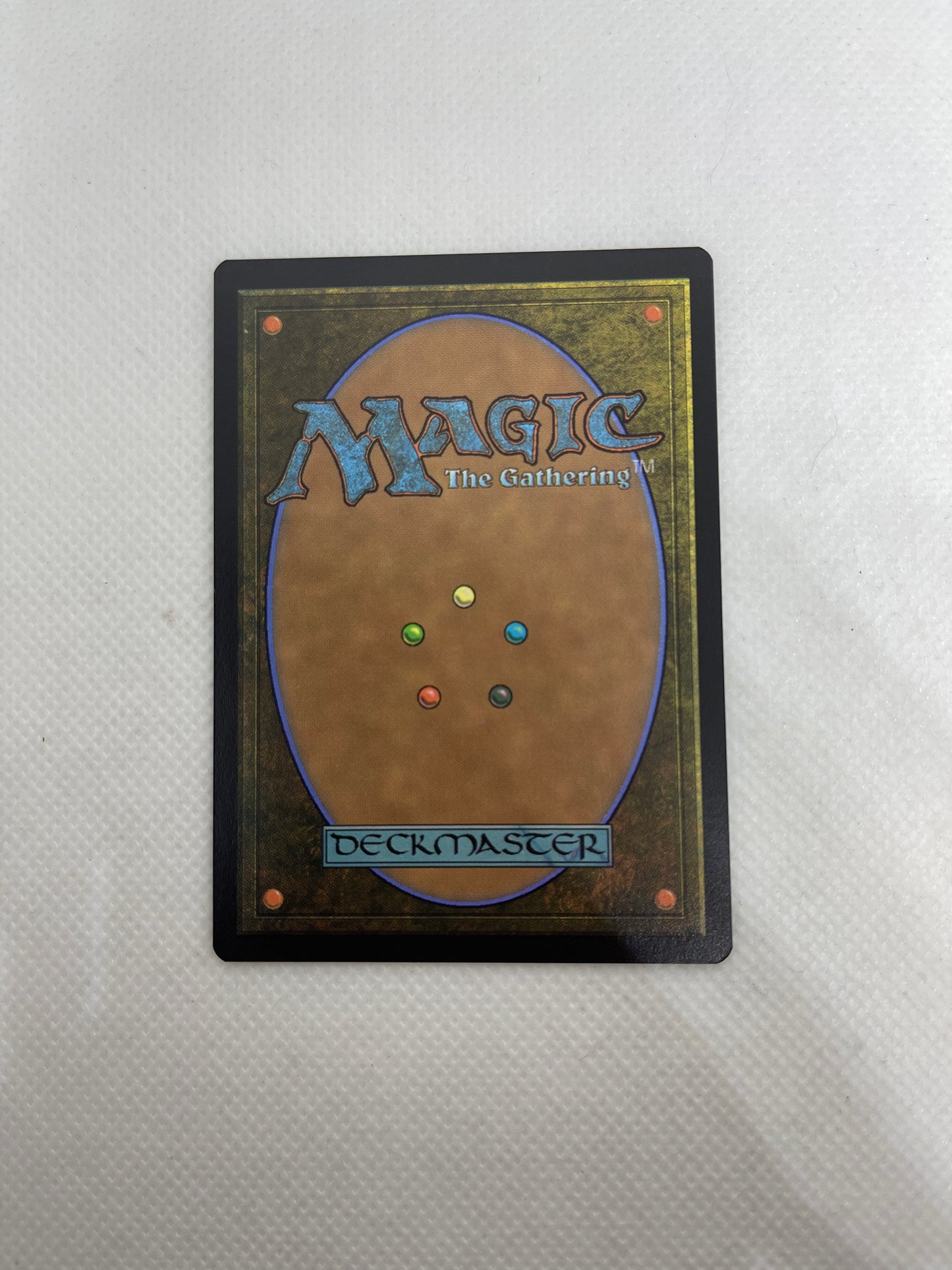 Trading card from 'Magic: The Gathering' on a textured surface