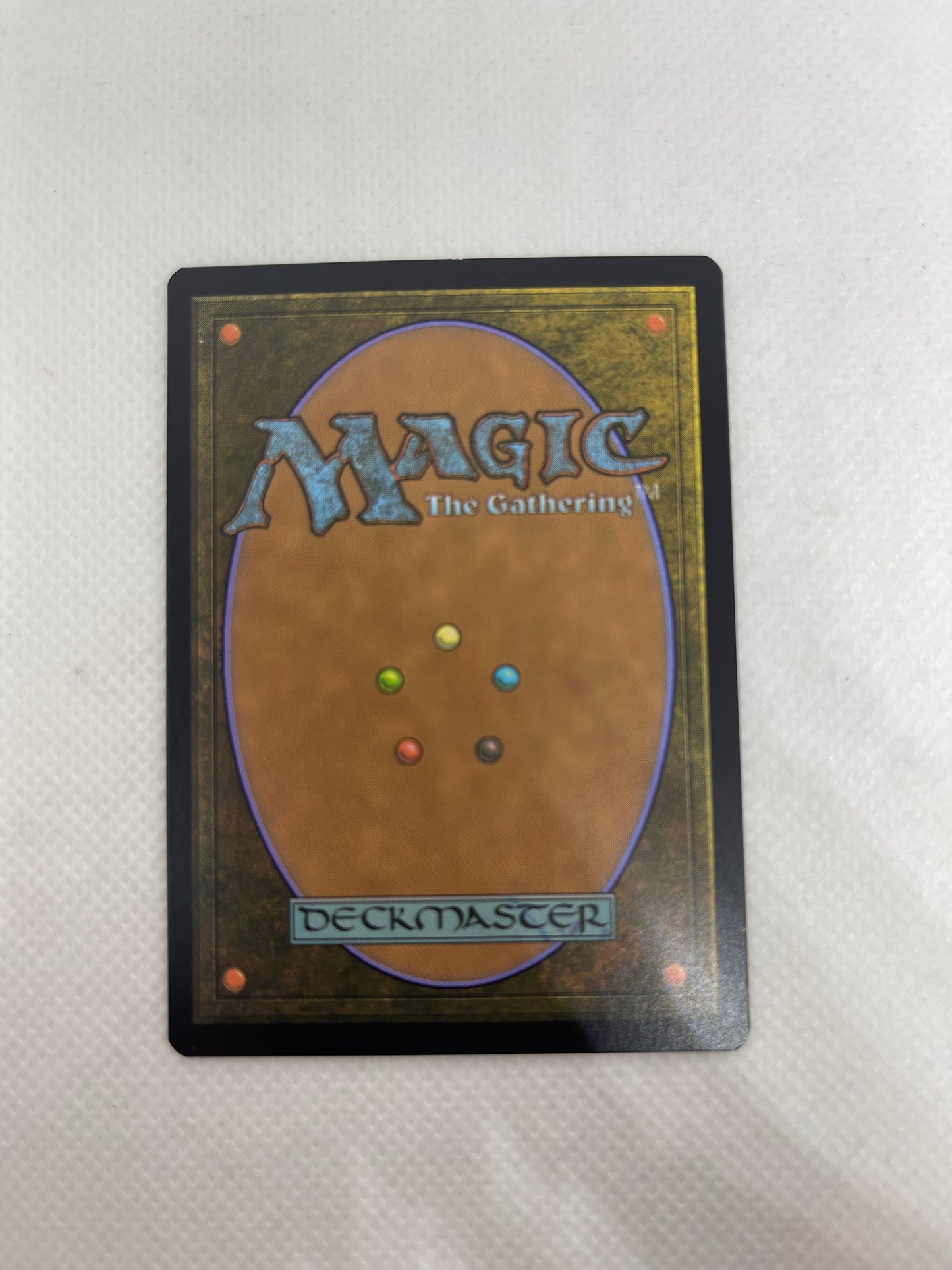 Trading card from 'Magic: The Gathering' on a textured surface