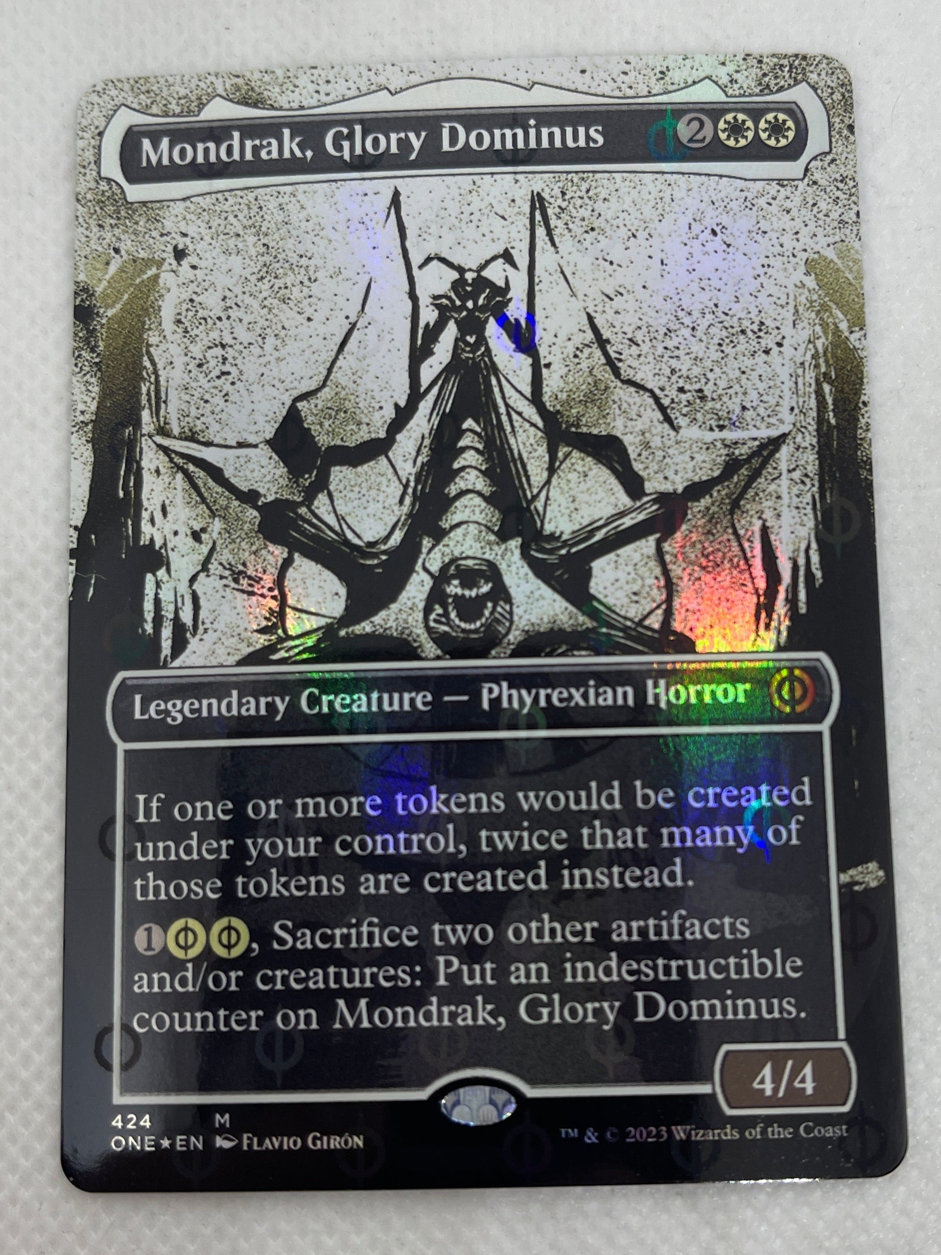 Damaged trading card with visible wear on a white surface