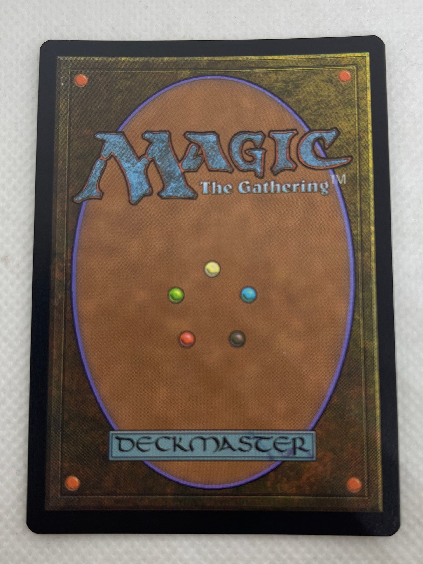 Trading card with 'Magic: The Gathering' branding on a textured surface