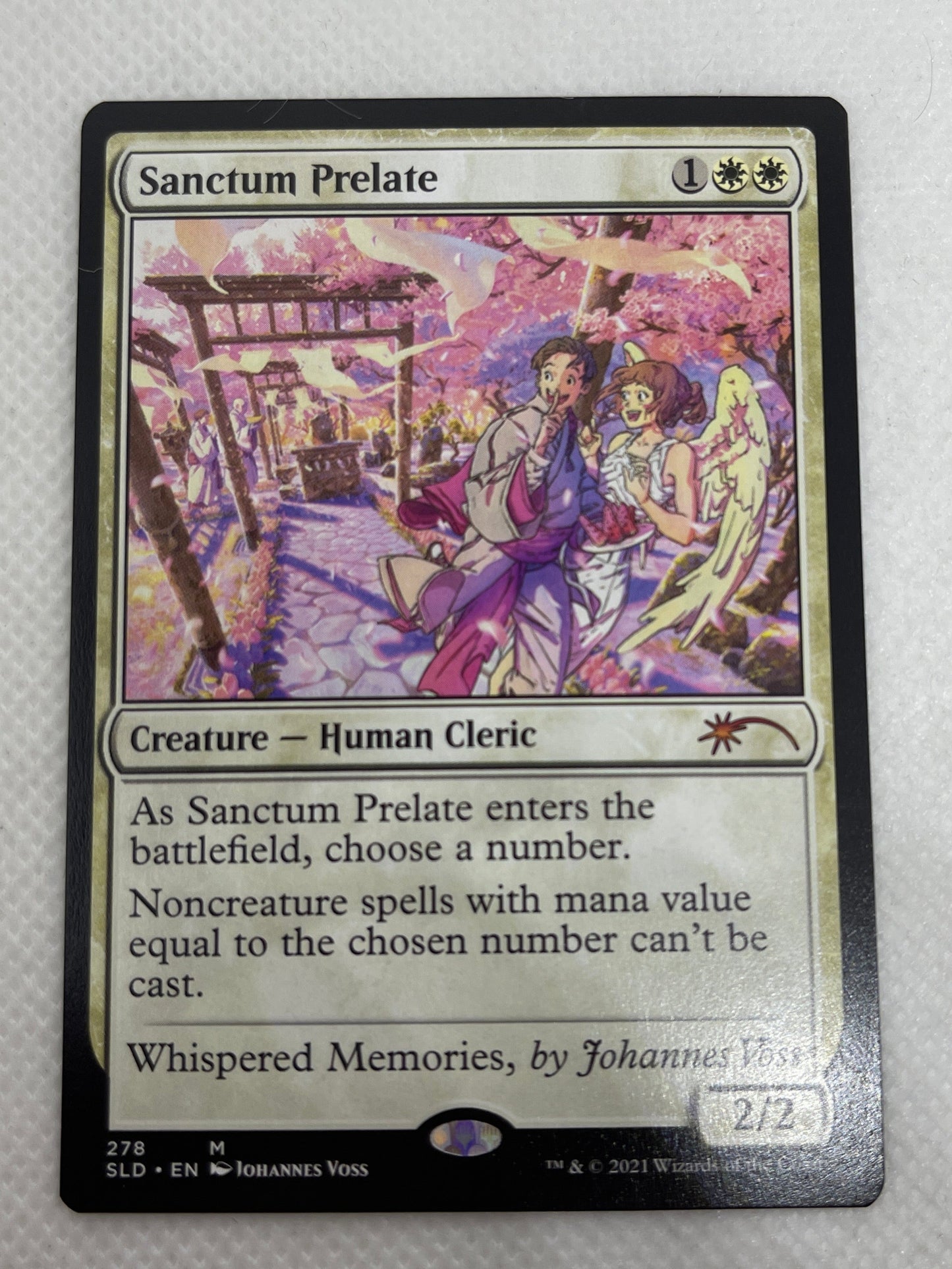 Trading card with colorful artwork on a white background