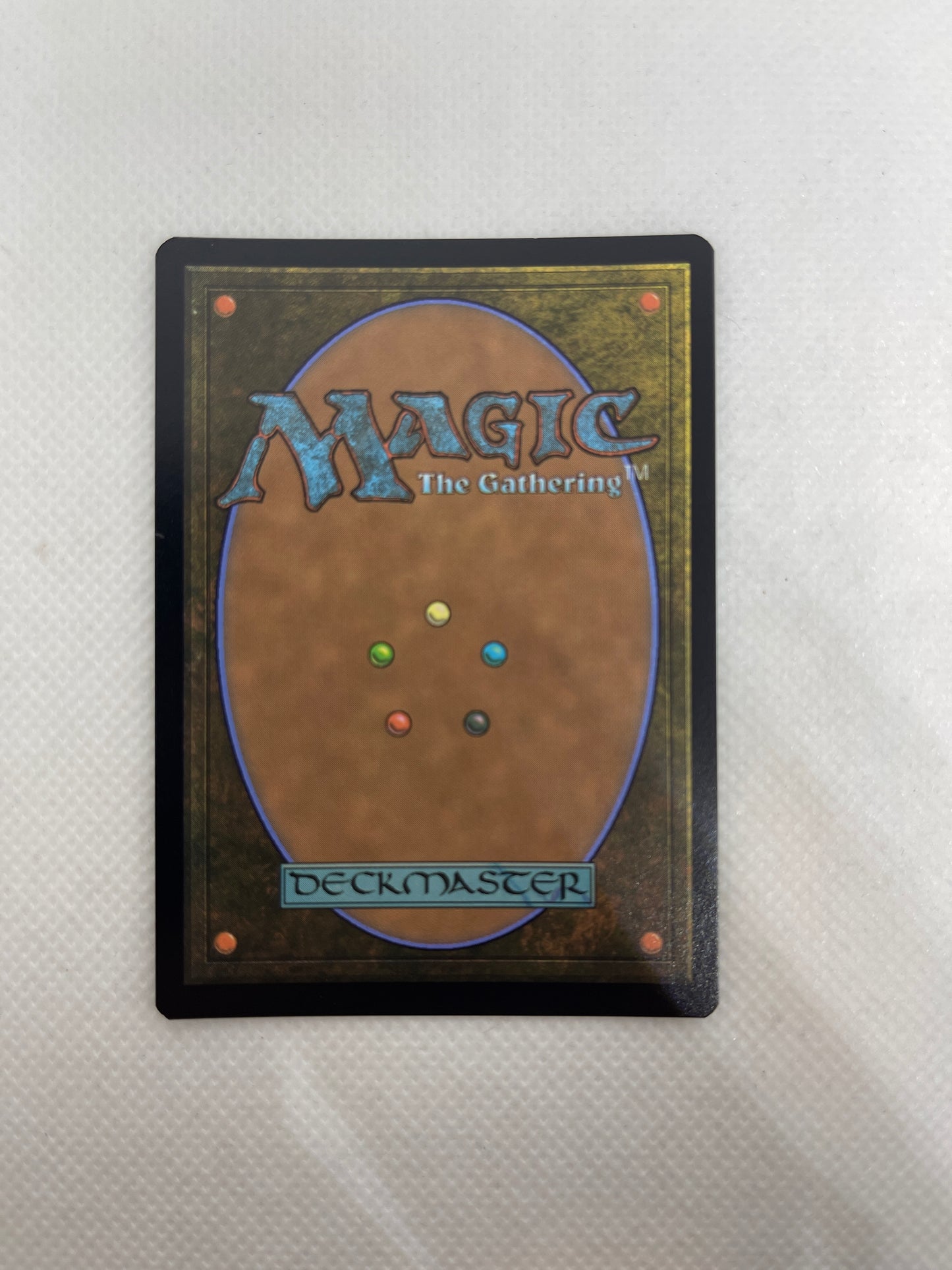 Card with 'Magic: The Gathering' branding on a textured surface