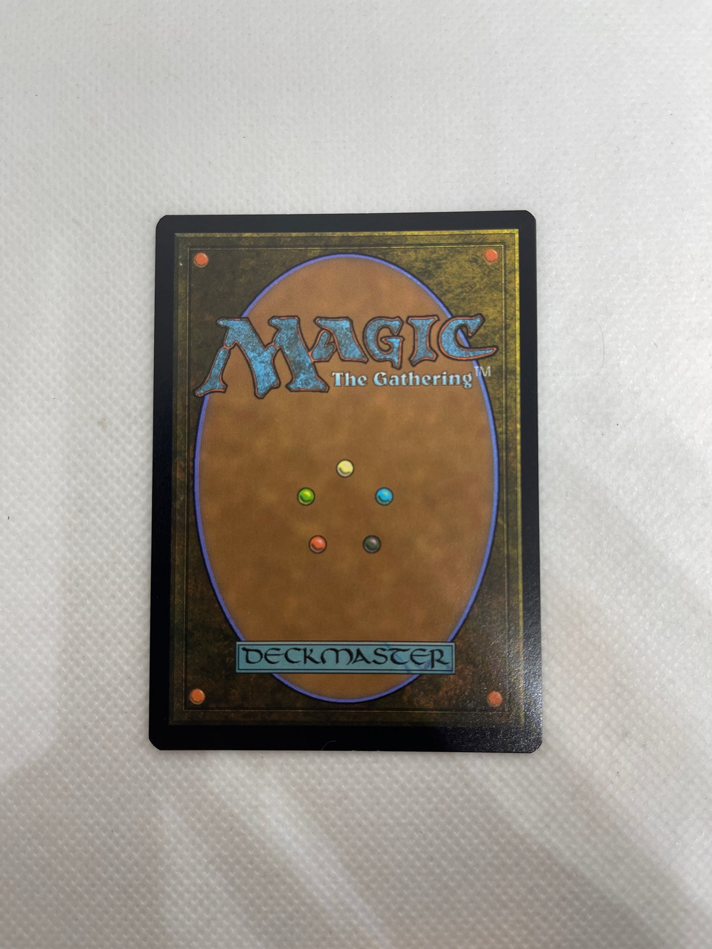 Trading card from 'Magic: The Gathering' on a textured surface