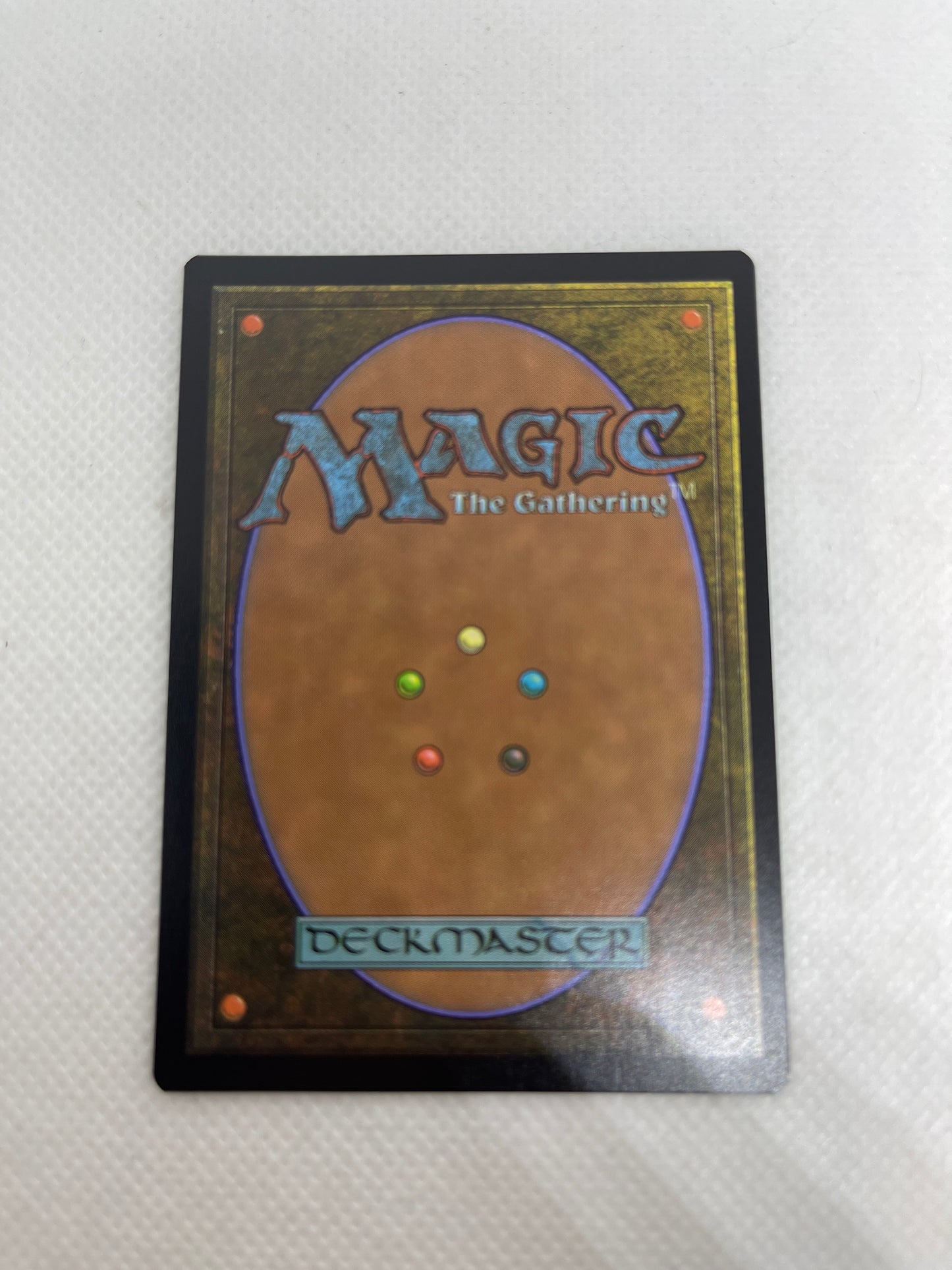 Trading card from 'Magic: The Gathering' on a textured surface