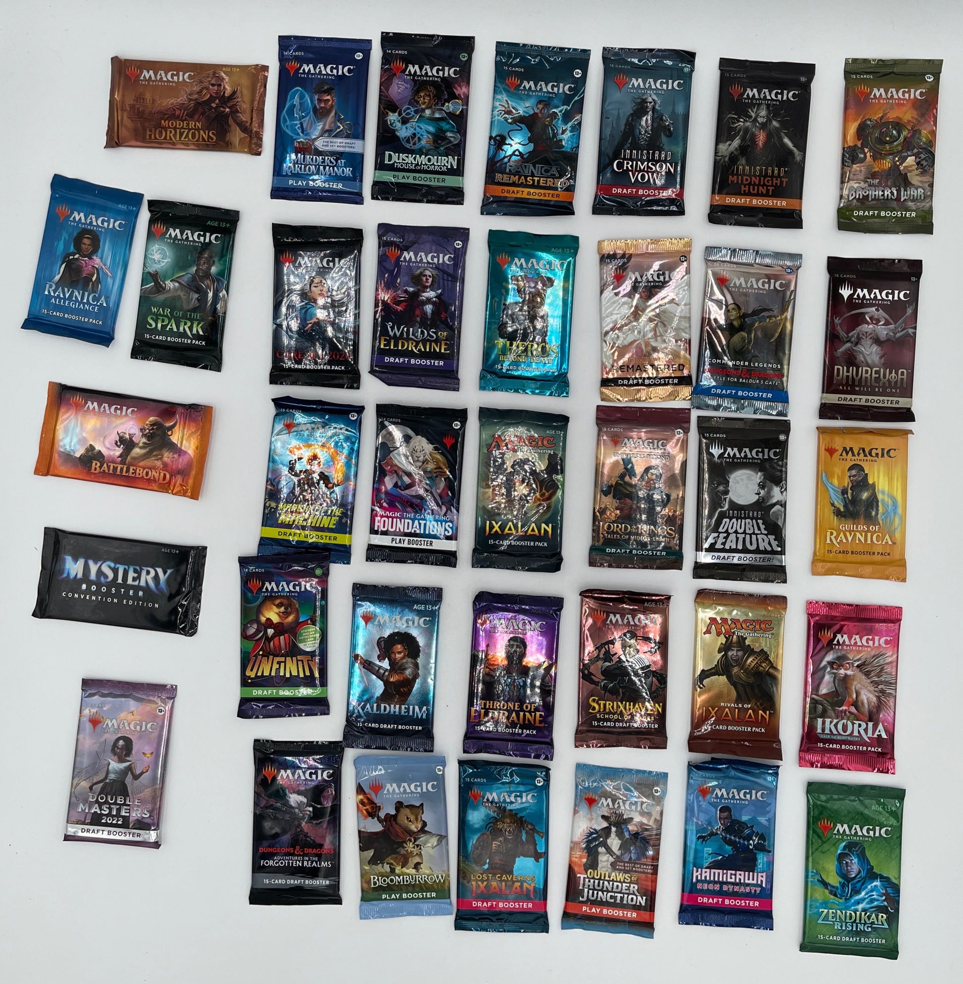 Collection of small booklets or cards with various covers on a white surface