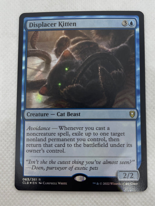 Trading card featuring a cat-like creature on a white background