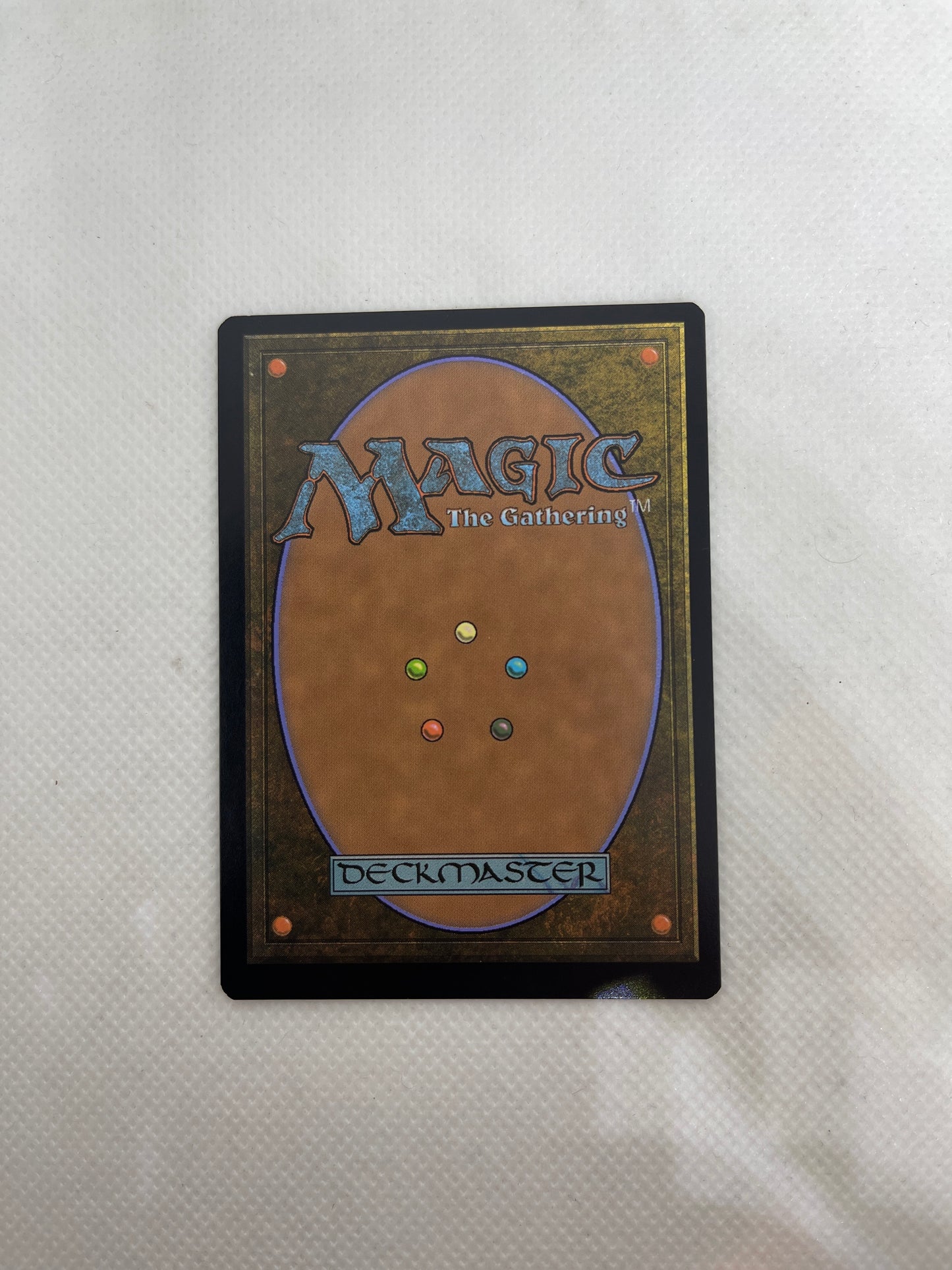Card with 'Magic: The Gathering' branding on a textured white background