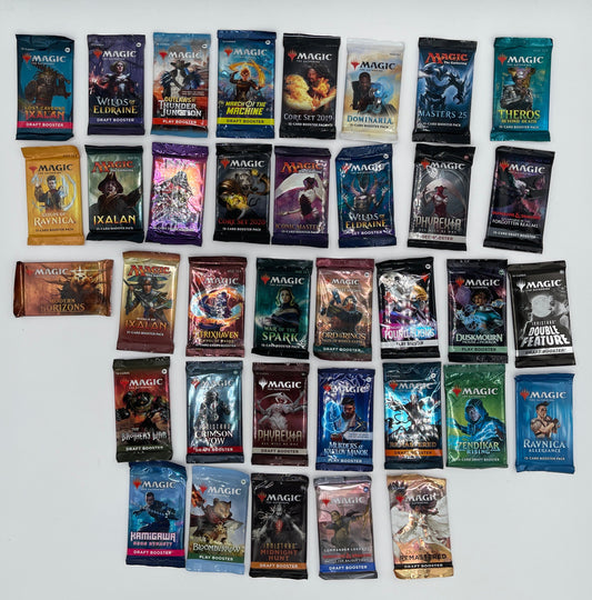 Collection of trading card packs arranged in a grid on a white surface