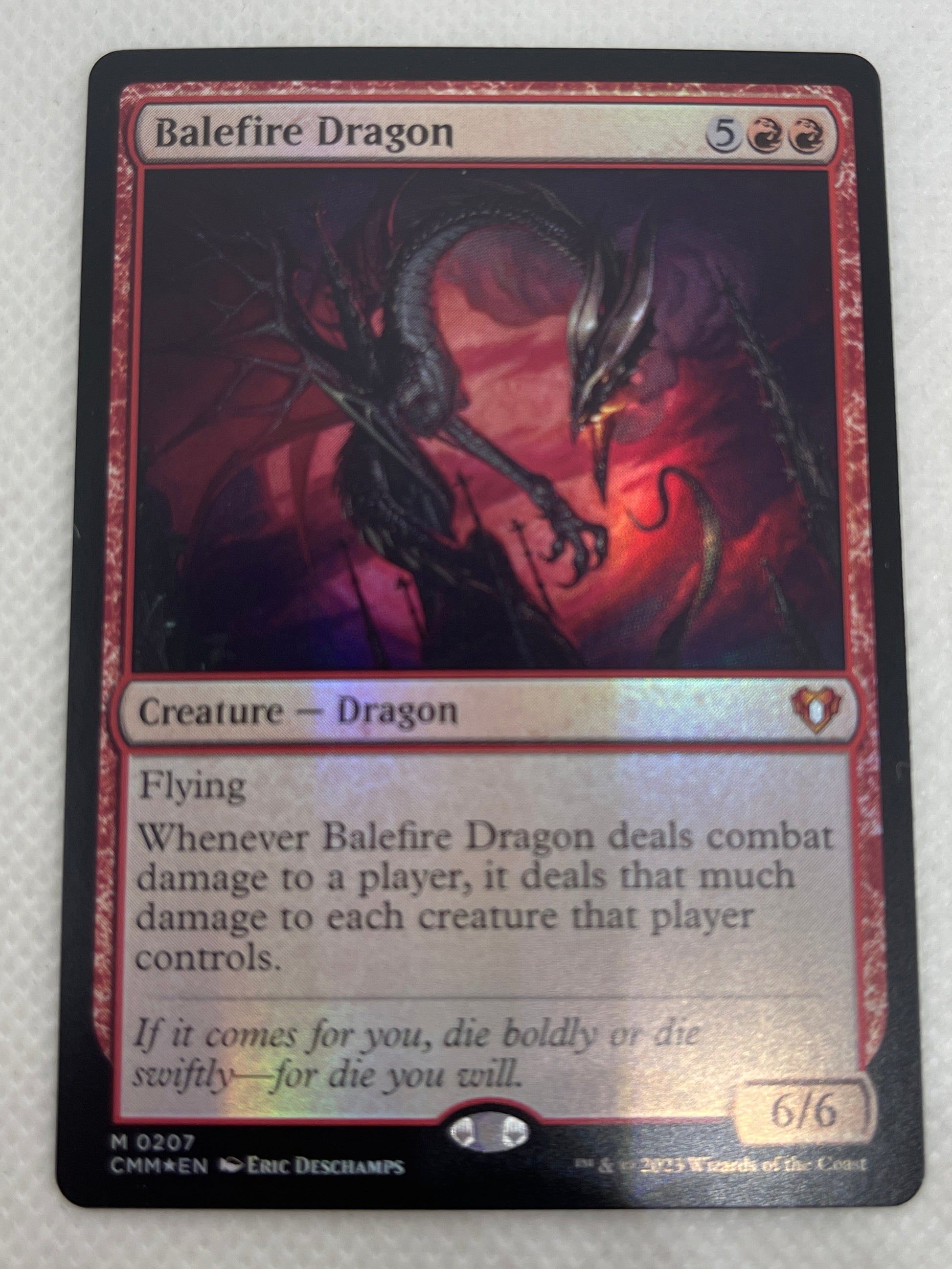 Trading card featuring a Baldric Dragon on a white background