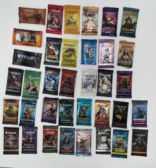 Collection of trading card packs arranged in a grid on a white surface.