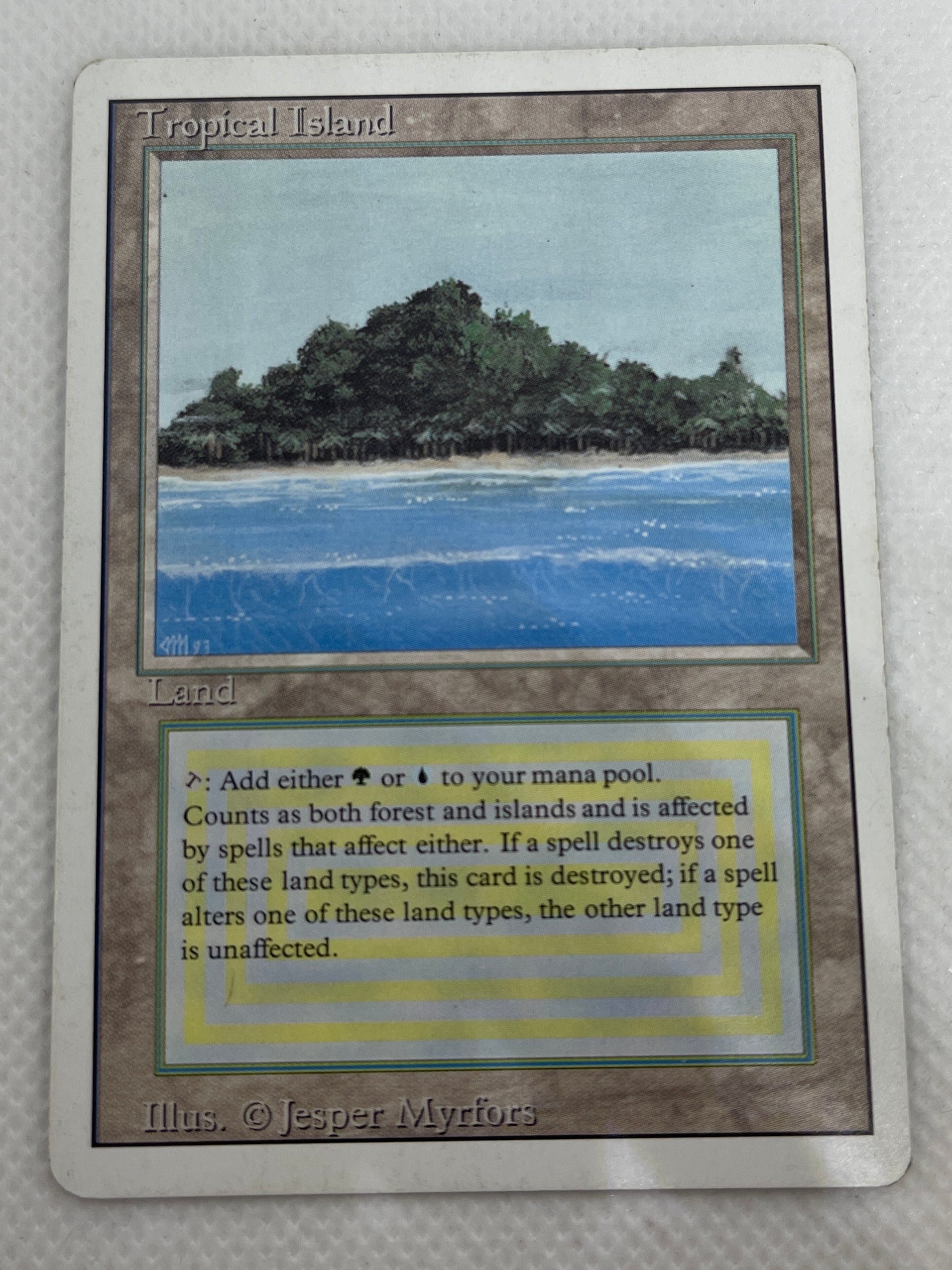 Trading card with scenic illustration and text on a textured surface