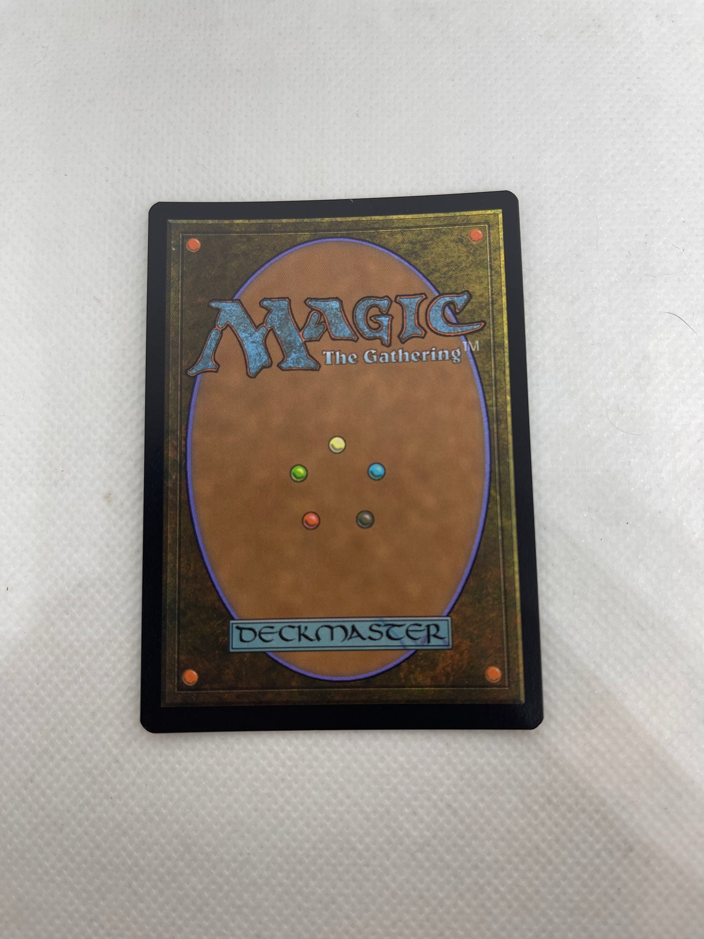 Trading card with 'Magic: The Gathering' logo and color symbols on a white background
