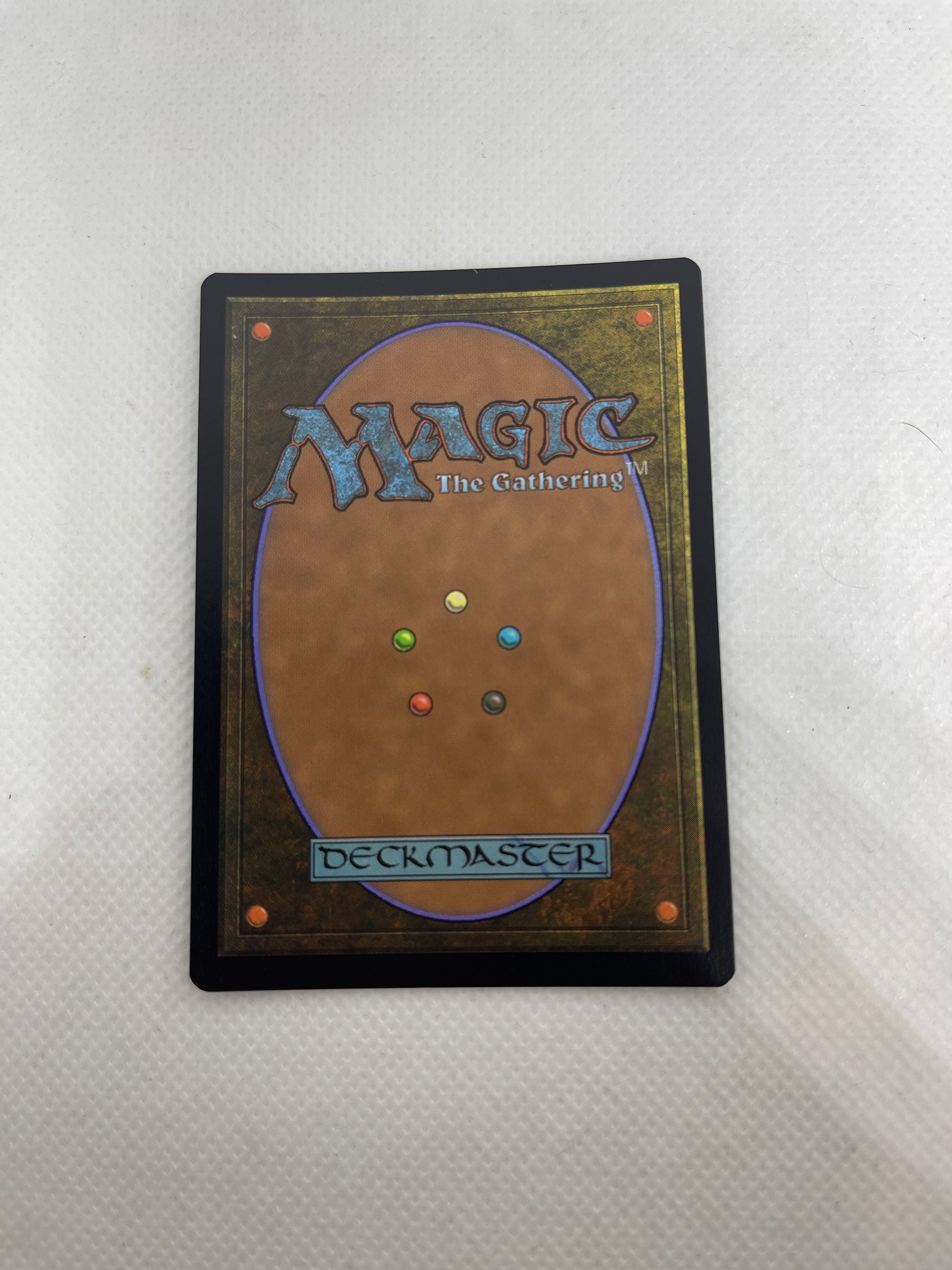 Trading card with 'Magic: The Gathering' logo and color symbols on a white background