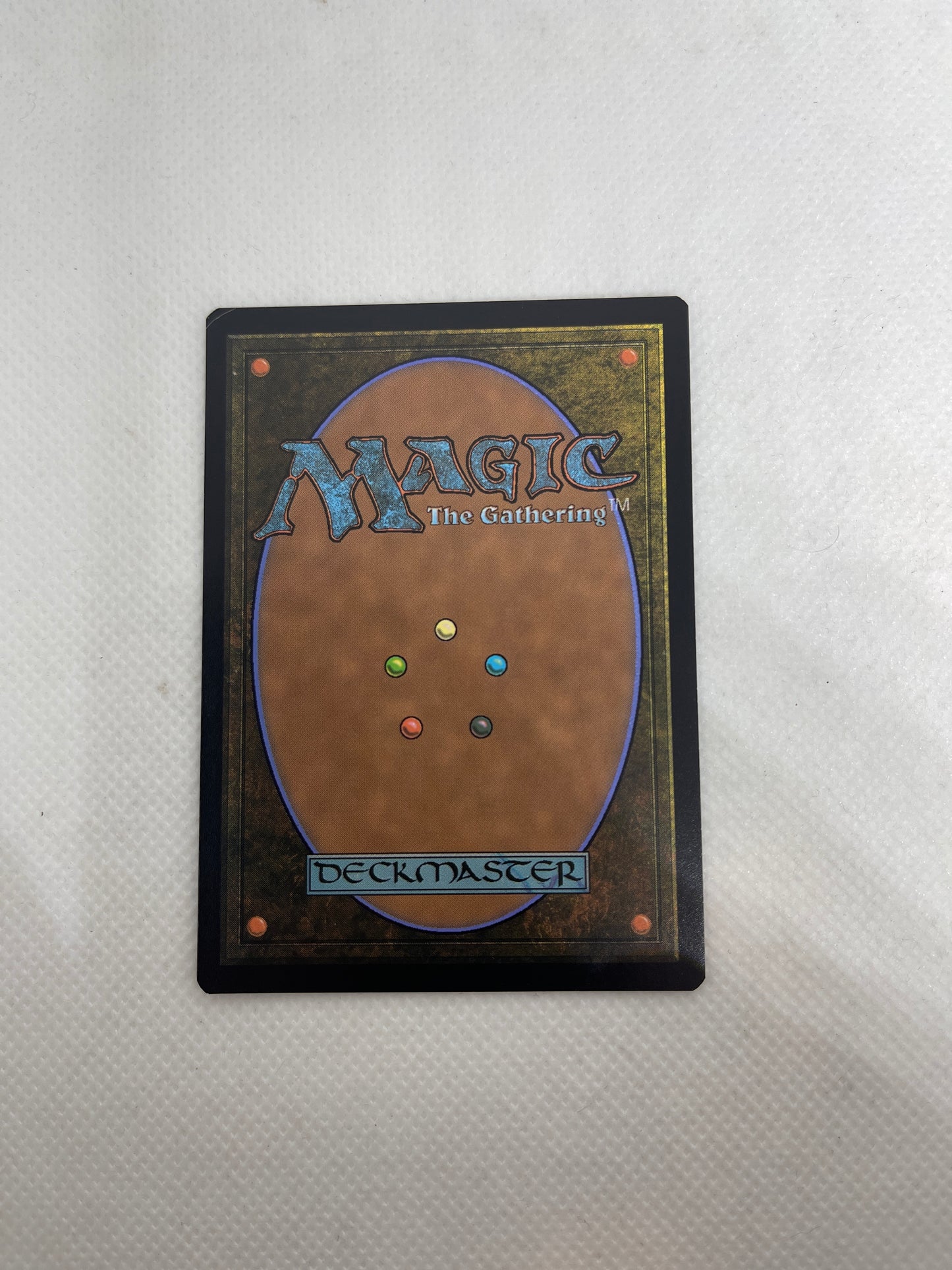 Trading card with 'Magic: The Gathering' branding on a textured surface