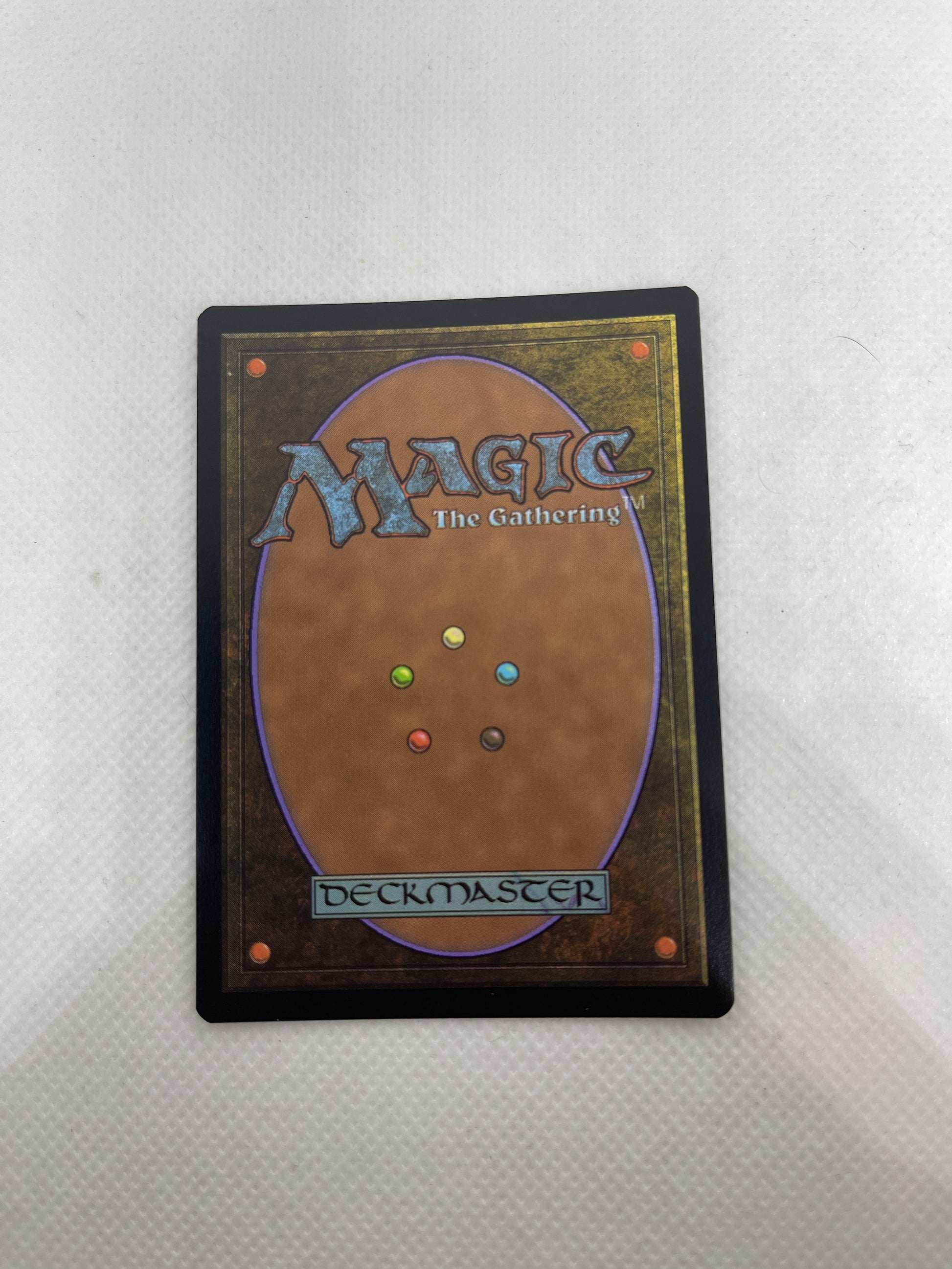 Card with 'Magic: The Gathering' branding on a textured surface
