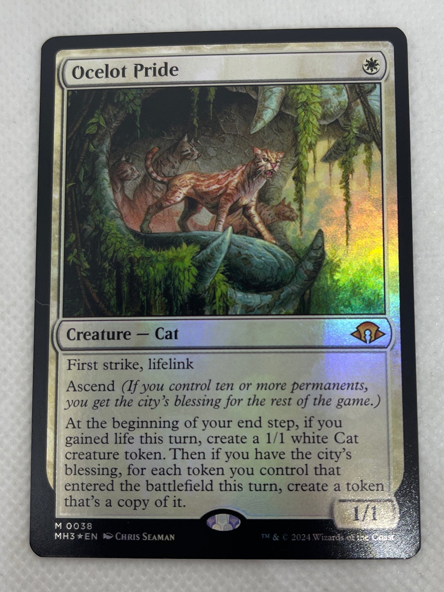 Card with fantasy artwork of a creature and text on a white background