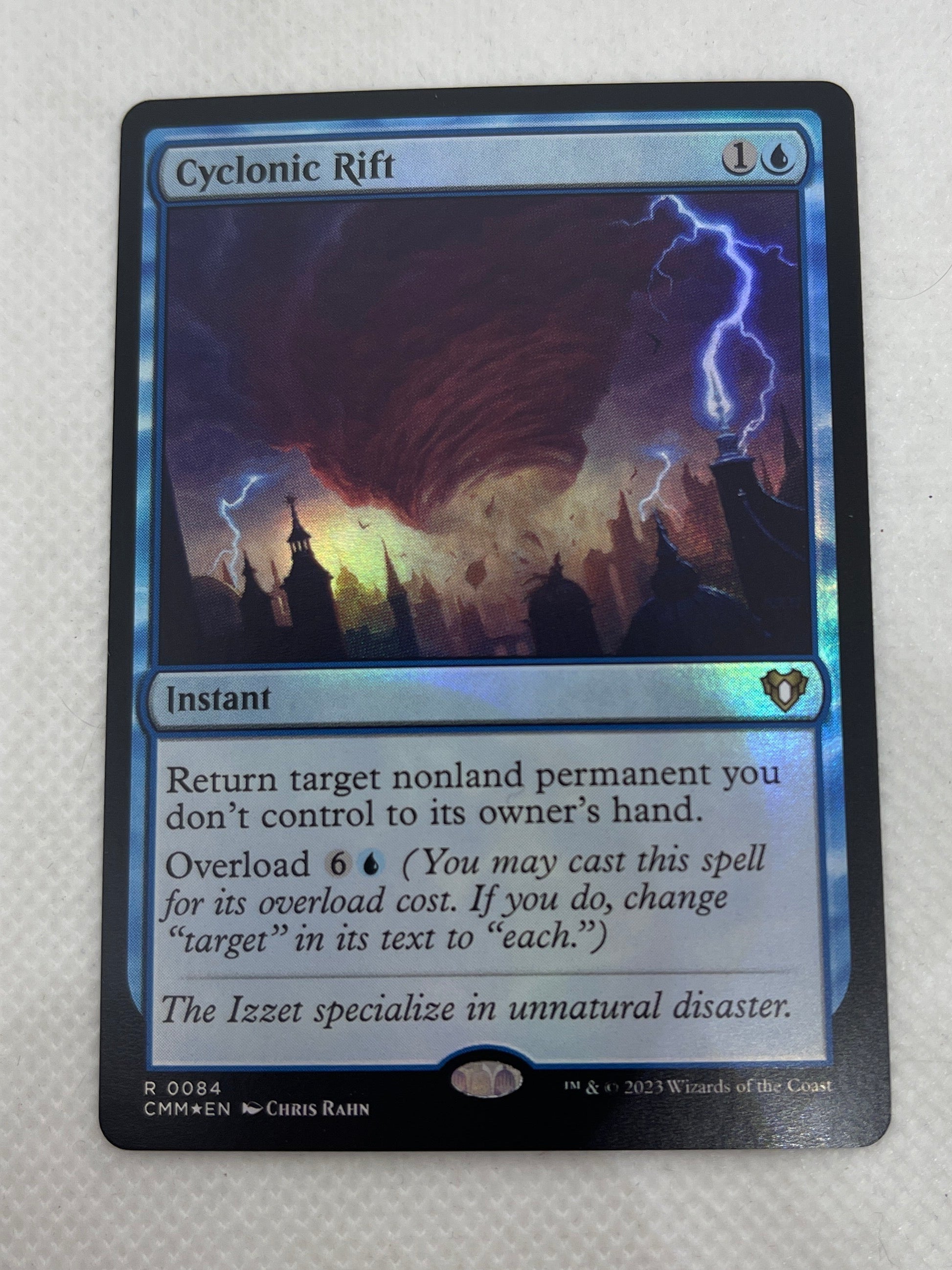 Trading card featuring a mountain graphic on a white surface