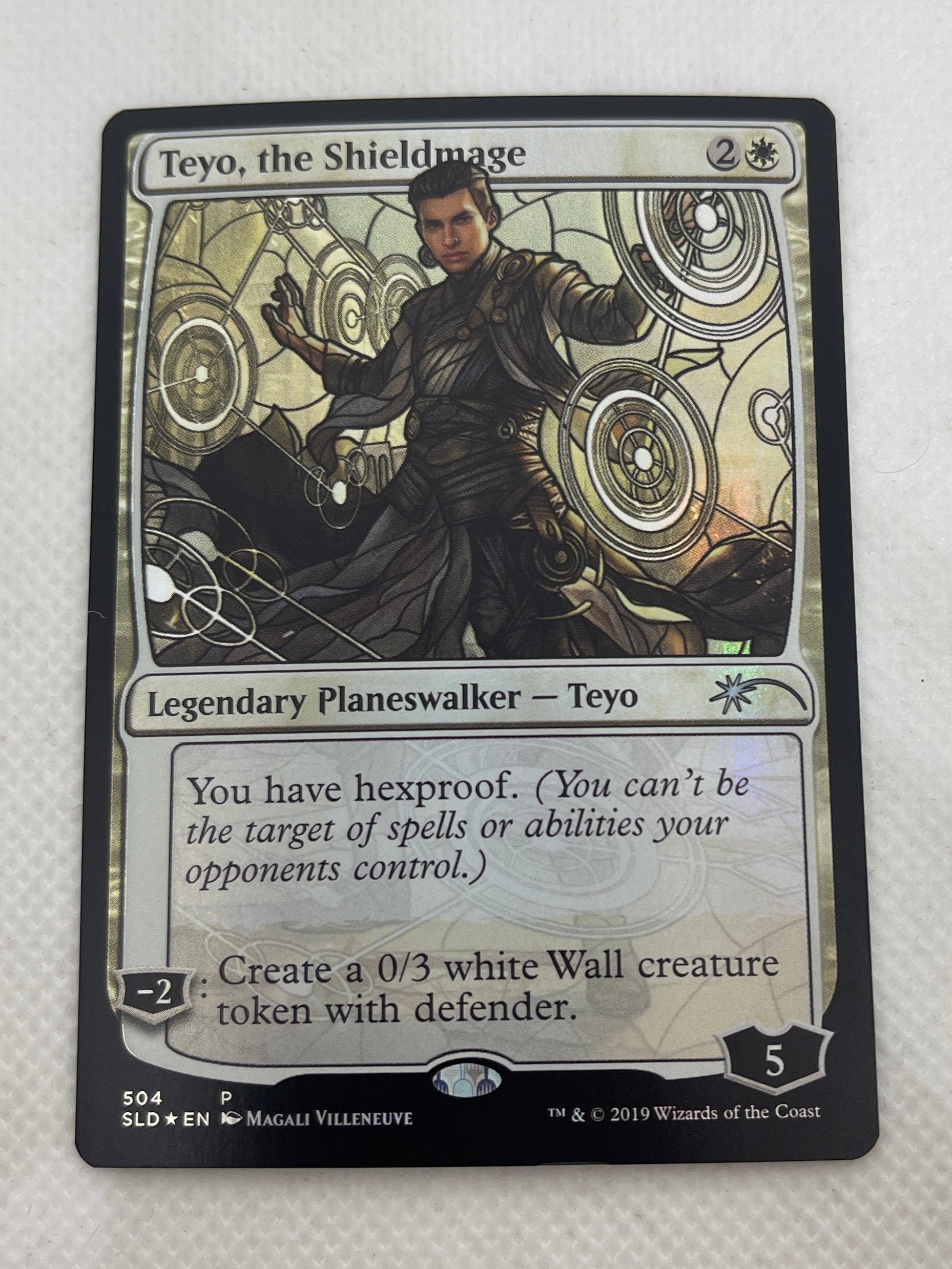 Trading card featuring a character in a fantasy setting on a white background