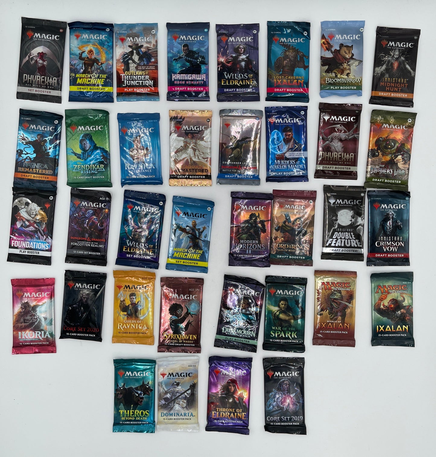 Collection of small booklets or cards with various covers arranged on a white surface.