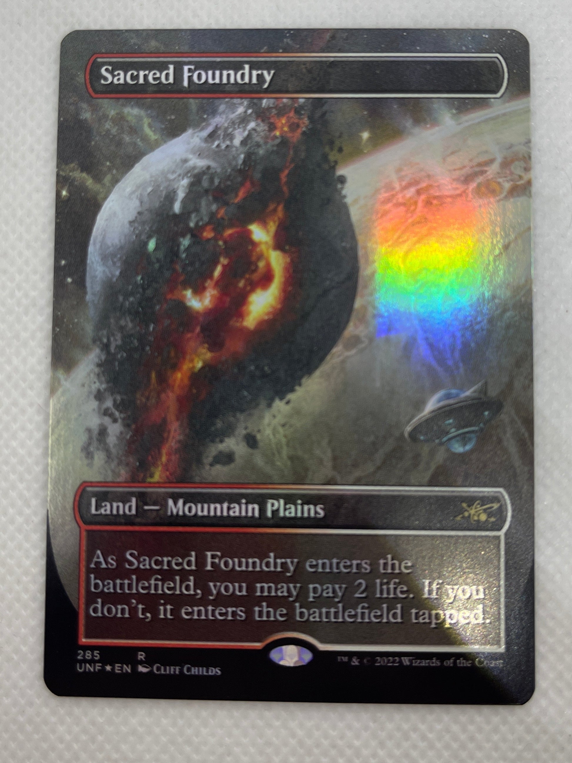 Trading card with cosmic design on a gray background