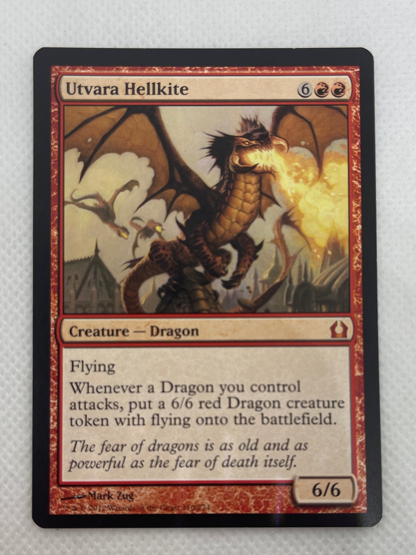 Trading card featuring a dragon on a textured gray background